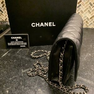 CHANEL Quilted Wallet On Chain WOC Black Lambskin with silver hardware.